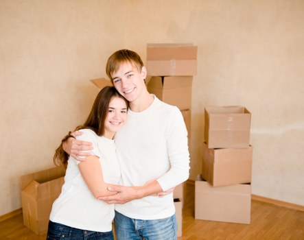 Professional movers unloading furniture at a property in Leaves Green