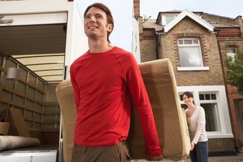 Careful loading of furniture into a moving van near Leaves Green