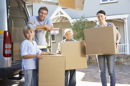 Removal van and moving boxes prepared for a Leaves Green home move