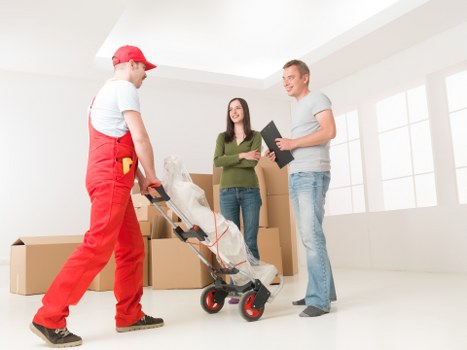 Household removal van moving furniture near Leaves Green