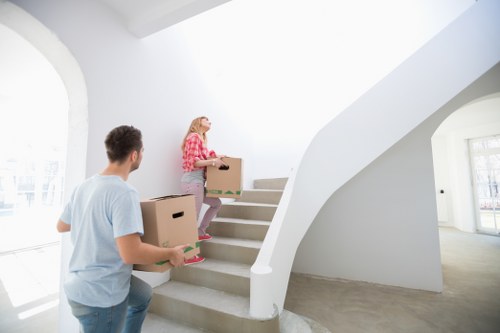 Furniture and boxes being moved by a local van service