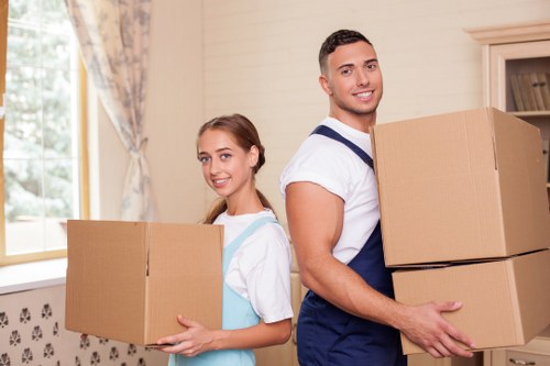 Furniture being carefully transported by movers in Leaves Green