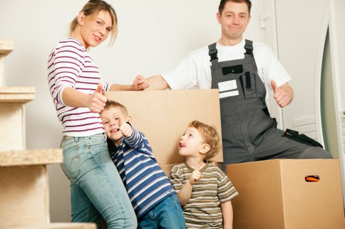 Boxes and furniture being loaded for a removals service